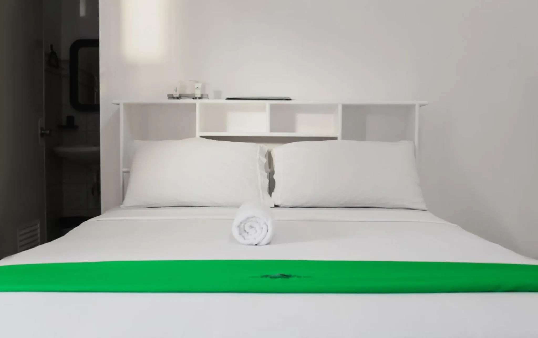 Bed in The Waterfront Beach Resort