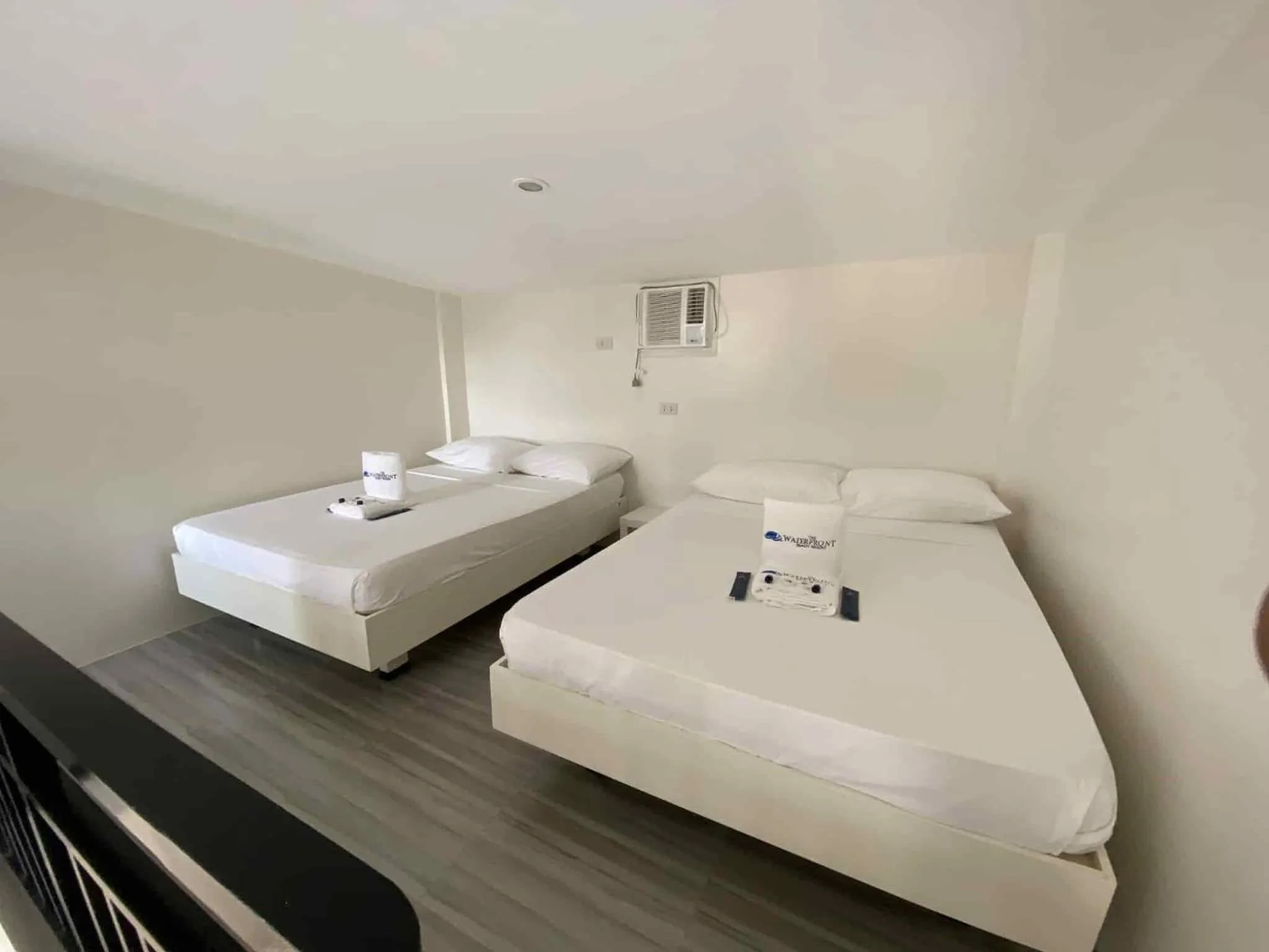 Bed in The Waterfront Beach Resort