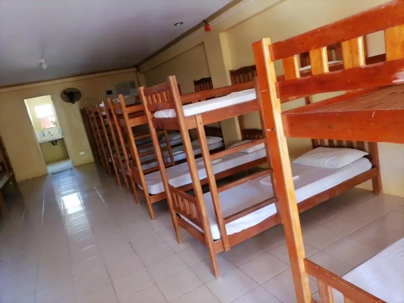 Bed in The Waterfront Beach Resort