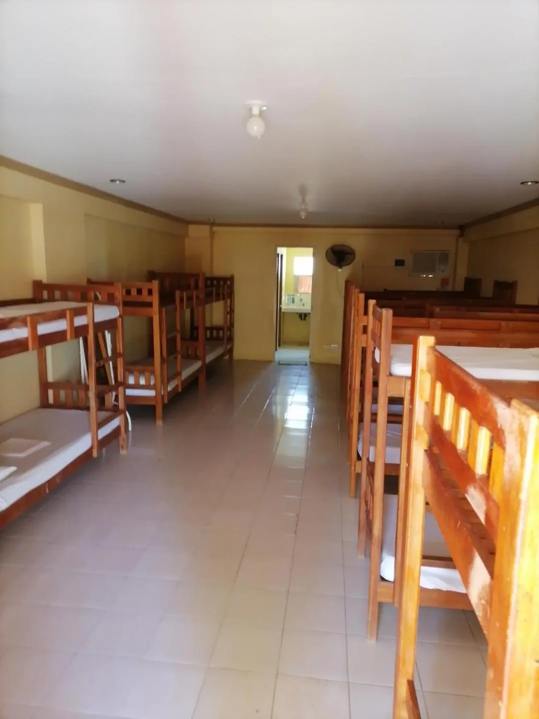 Bed in The Waterfront Beach Resort