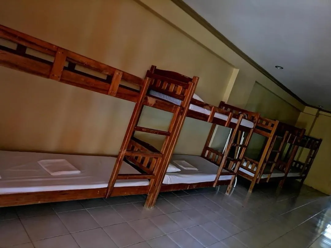 Bed in The Waterfront Beach Resort