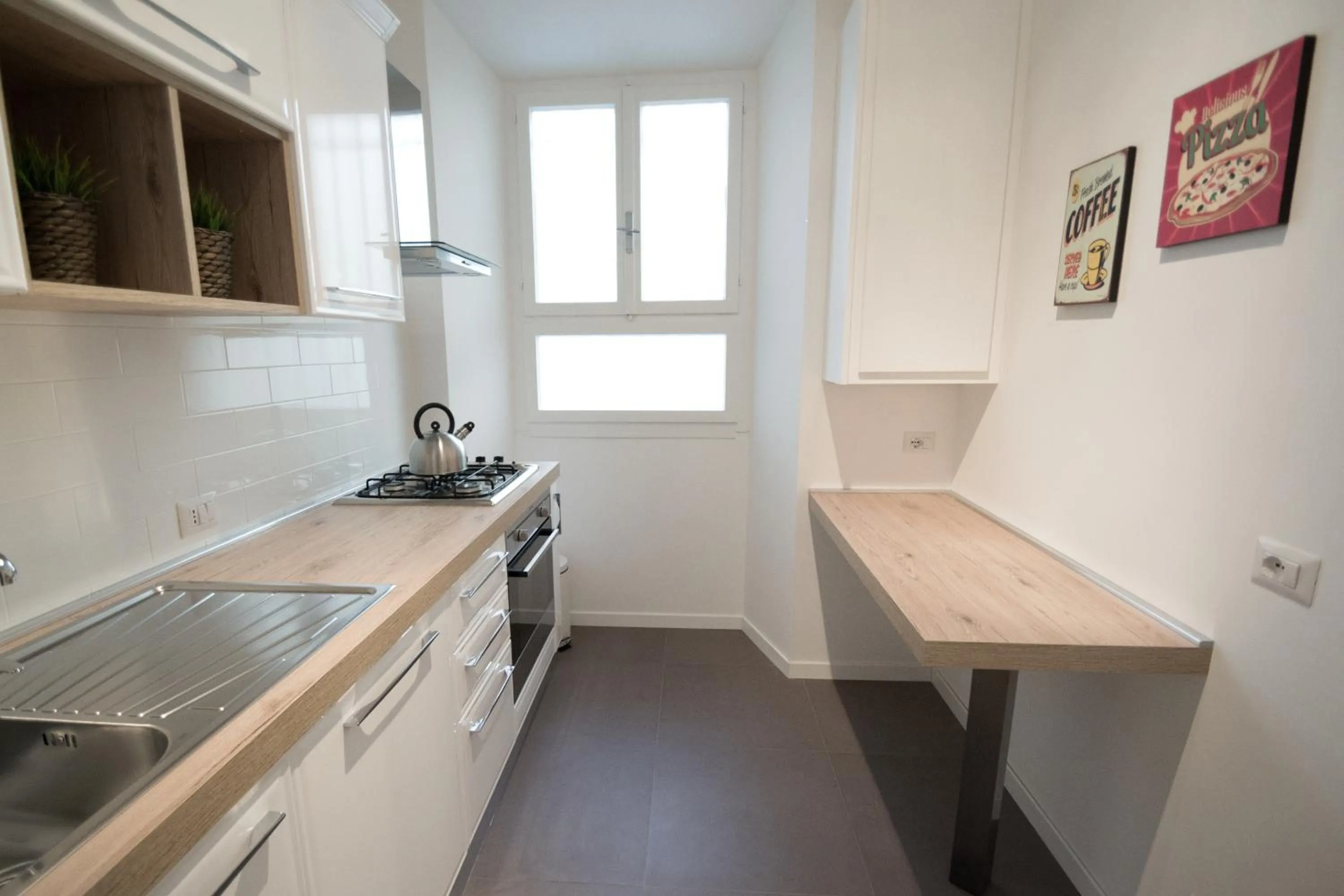 Communal kitchen in Vantaggio Apartment