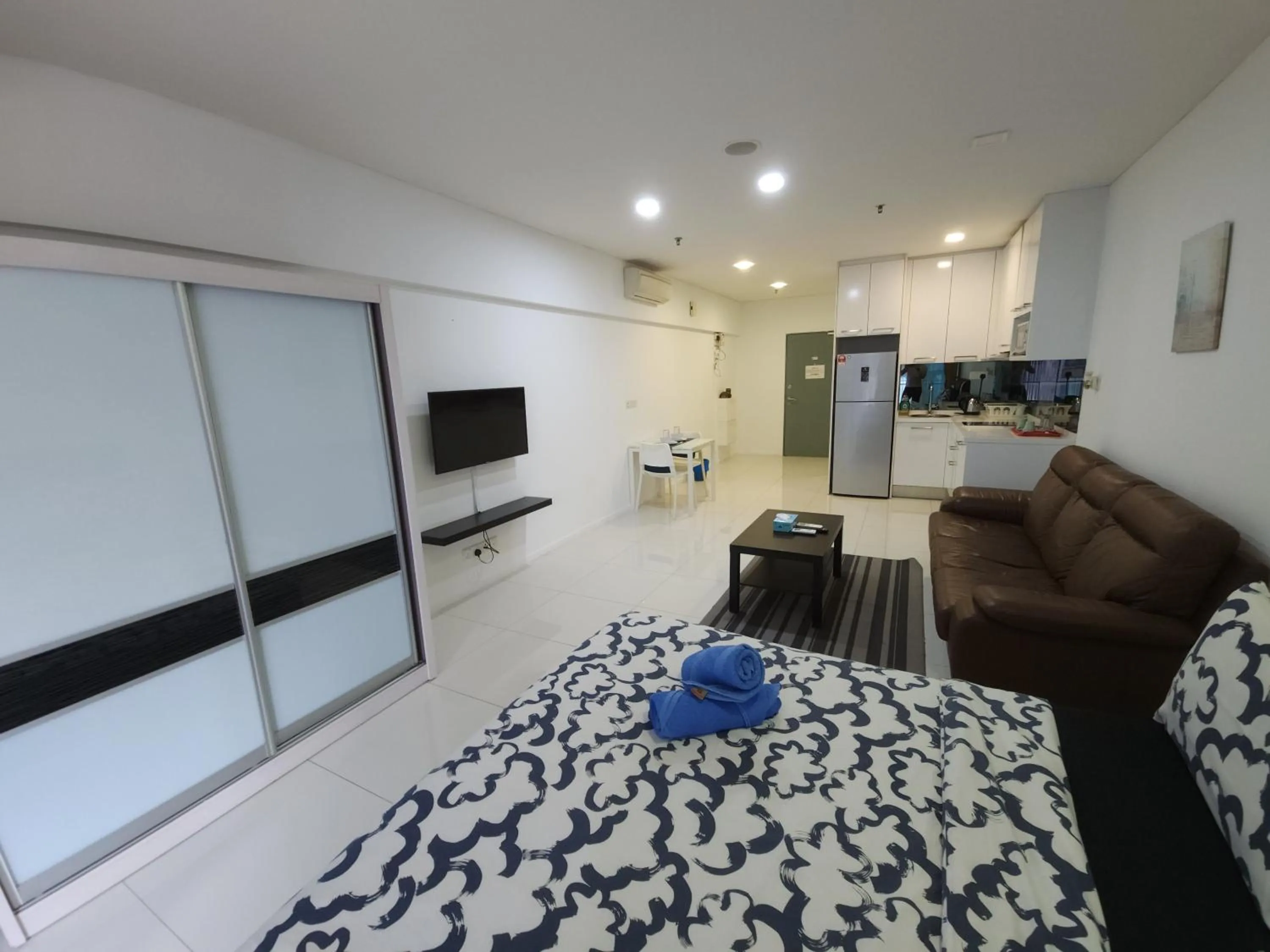 Bed in Summer Suites Studios