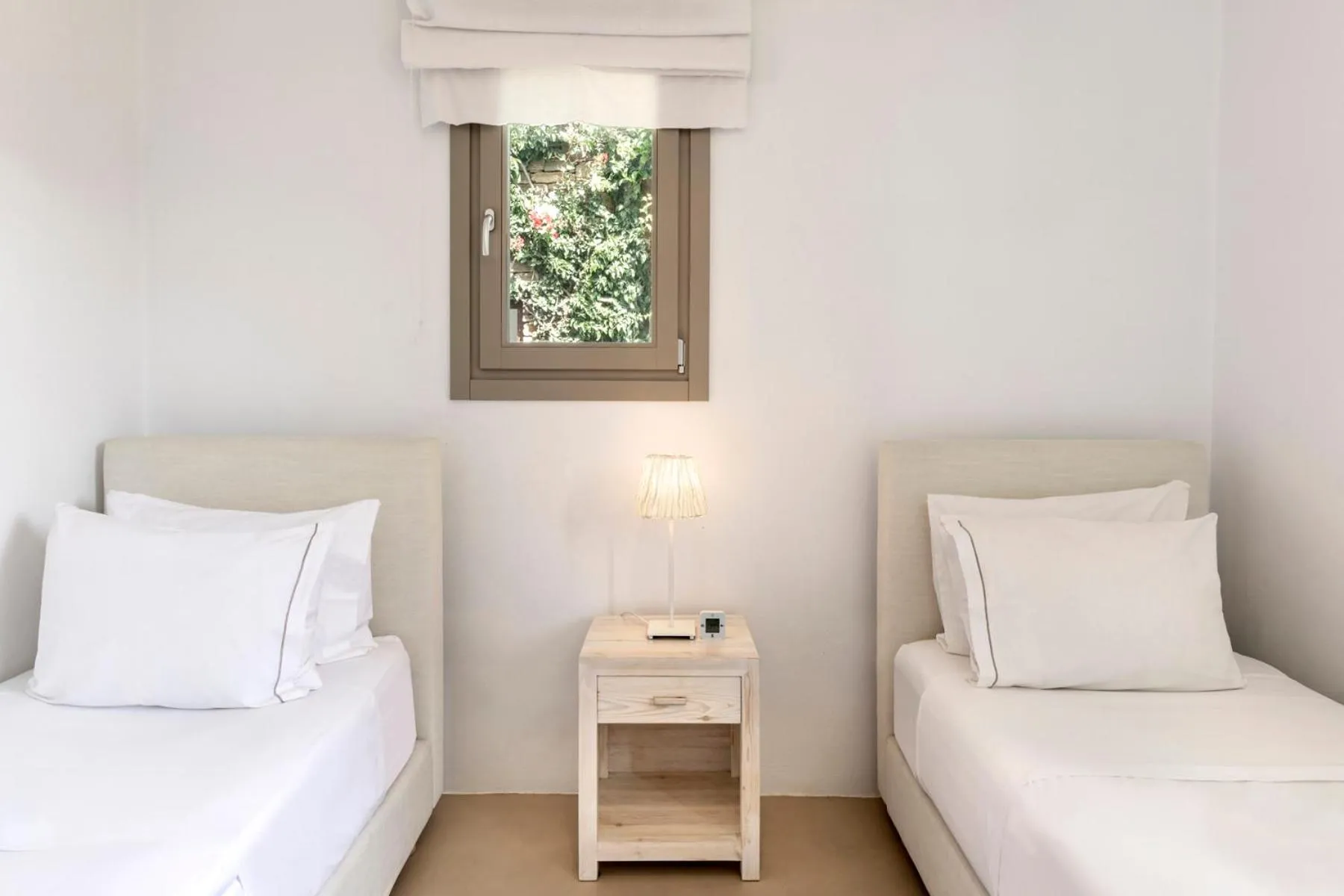 Bed in White Tinos Luxury Suites