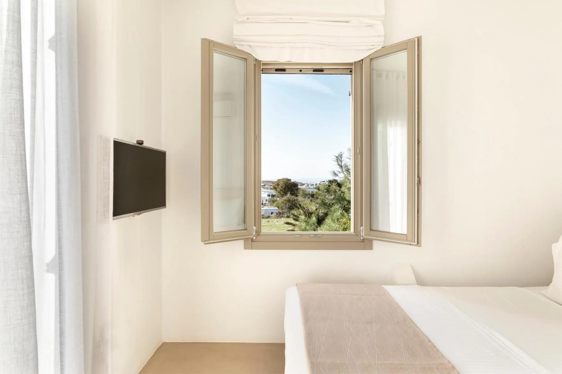 Bed in White Tinos Luxury Suites