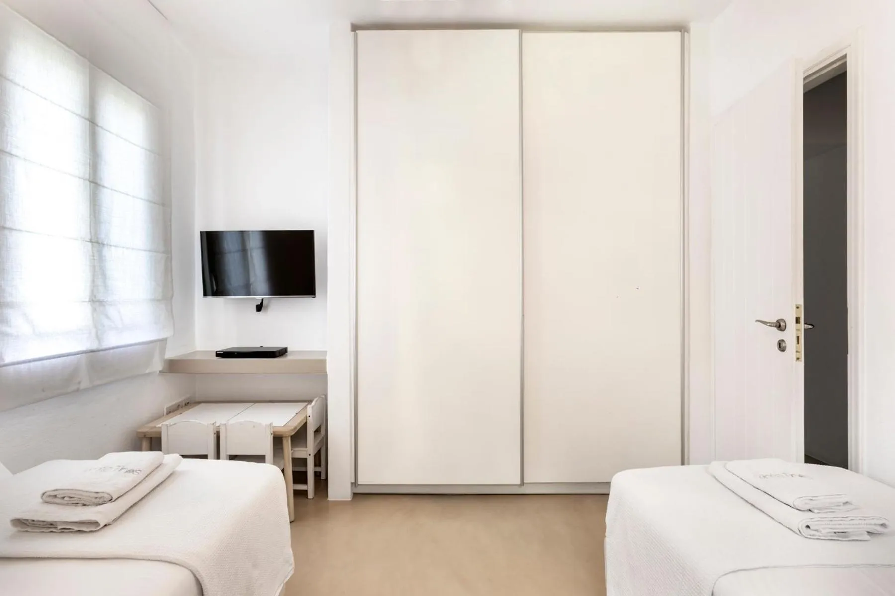 Bed in White Tinos Luxury Suites