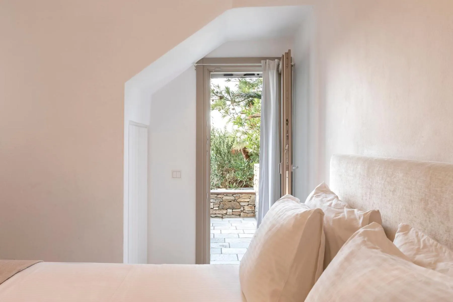 Bed in White Tinos Luxury Suites