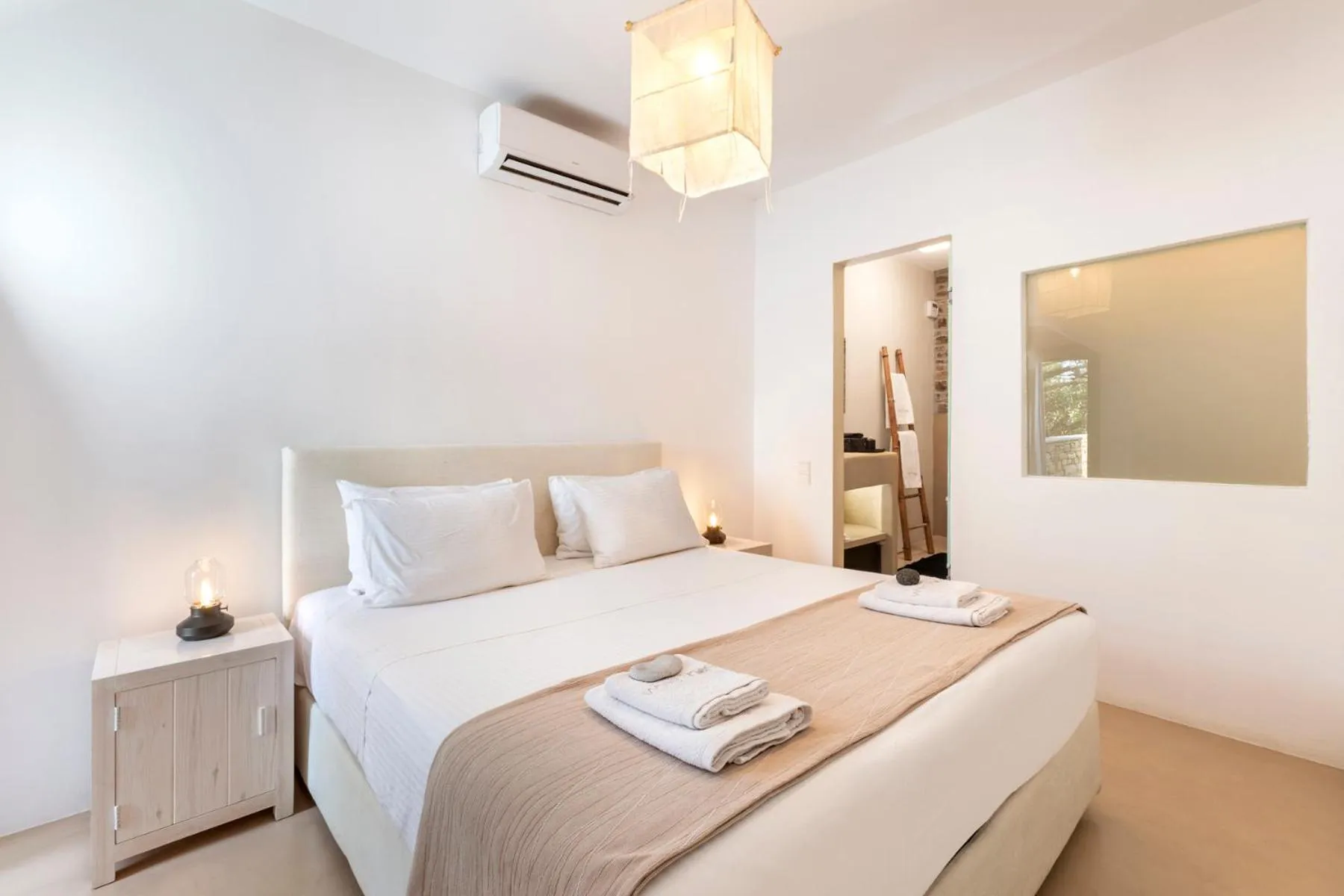 Bed in White Tinos Luxury Suites