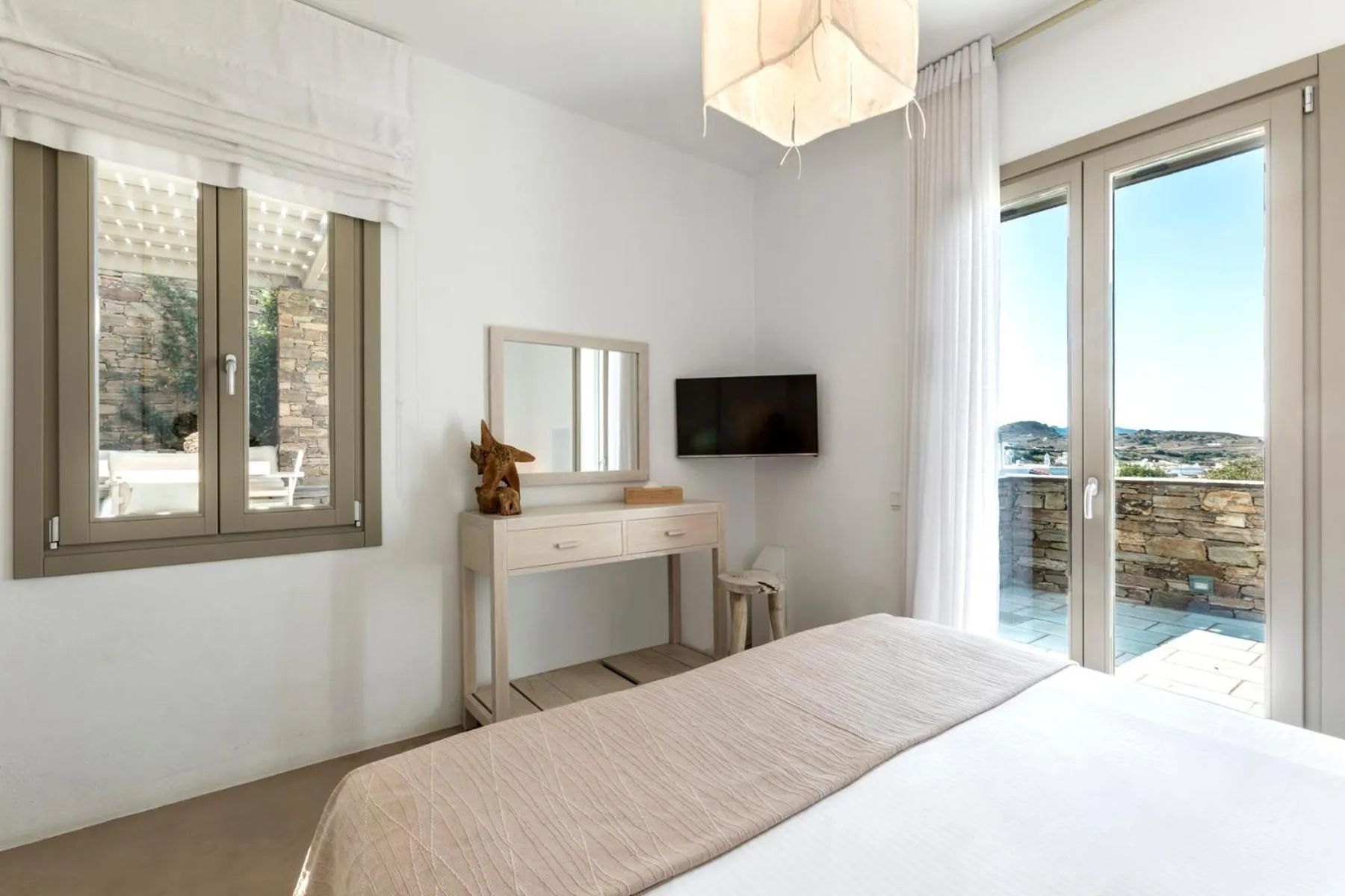 Bed in White Tinos Luxury Suites