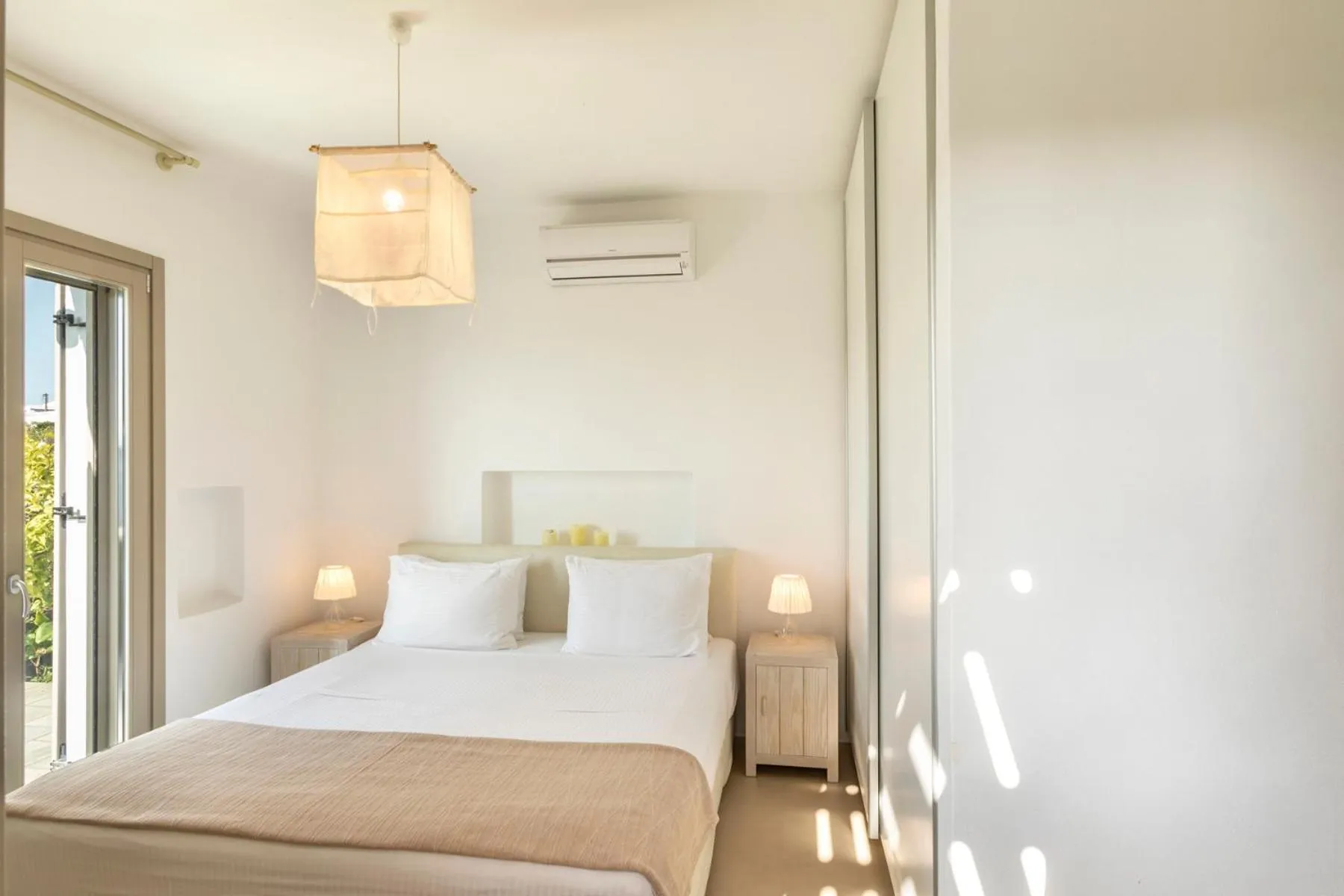 Bed in White Tinos Luxury Suites