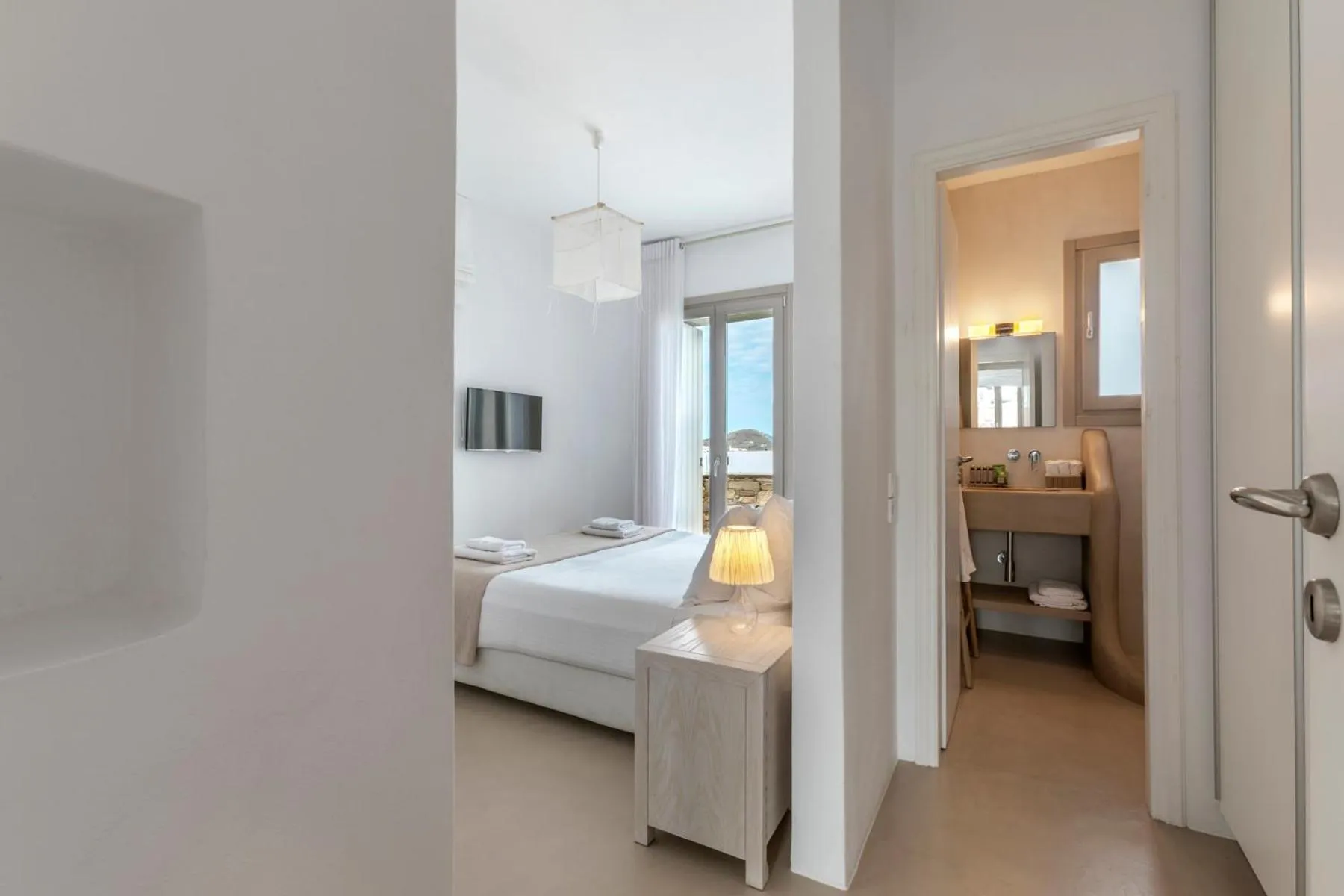 Bed in White Tinos Luxury Suites