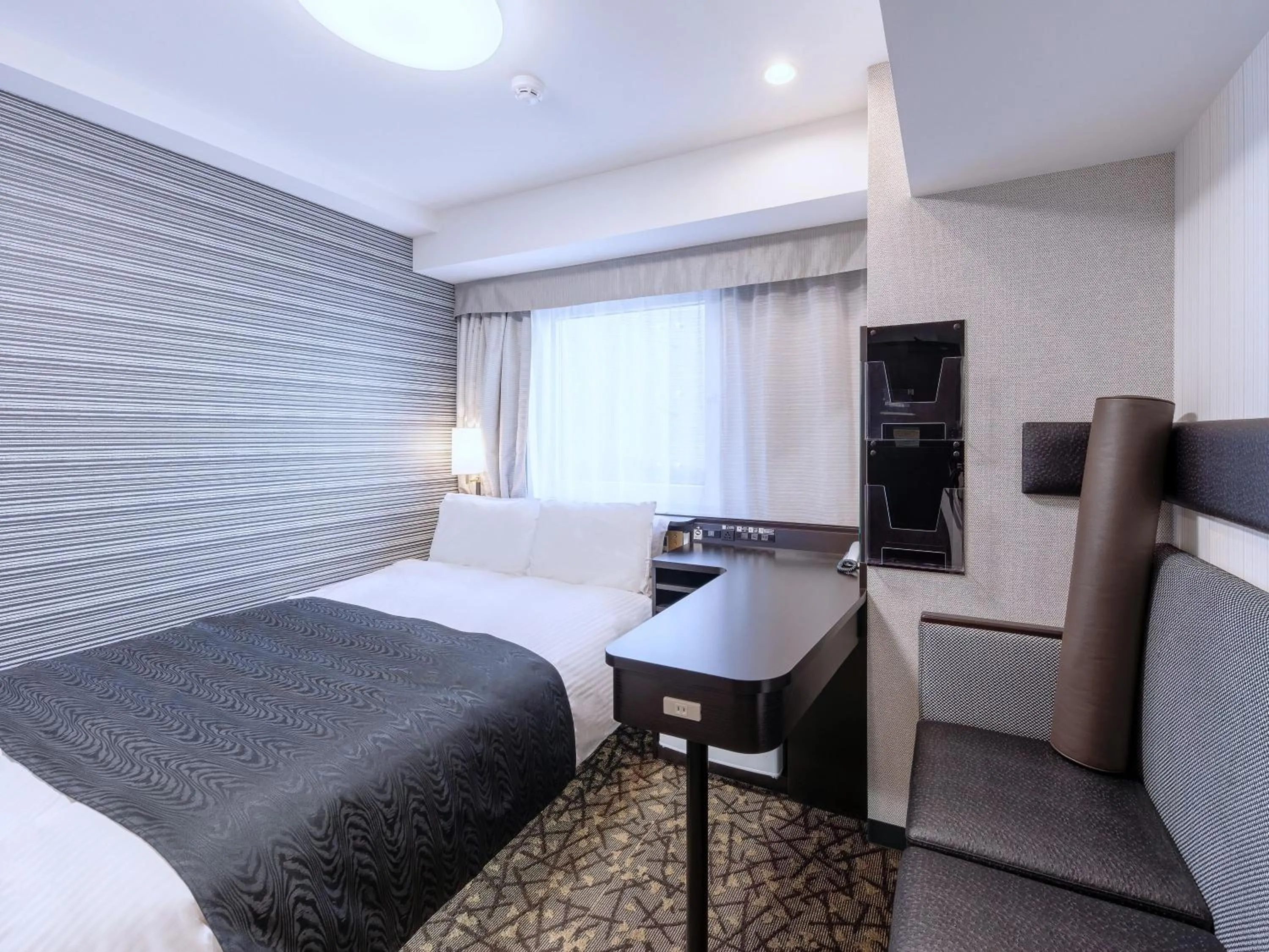 Photo of the whole room, Bed in APA Hotel Sapporo Odori Ekimae Nishi