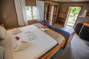 Bedroom, Bed in Barefoot Kuata Island Resort