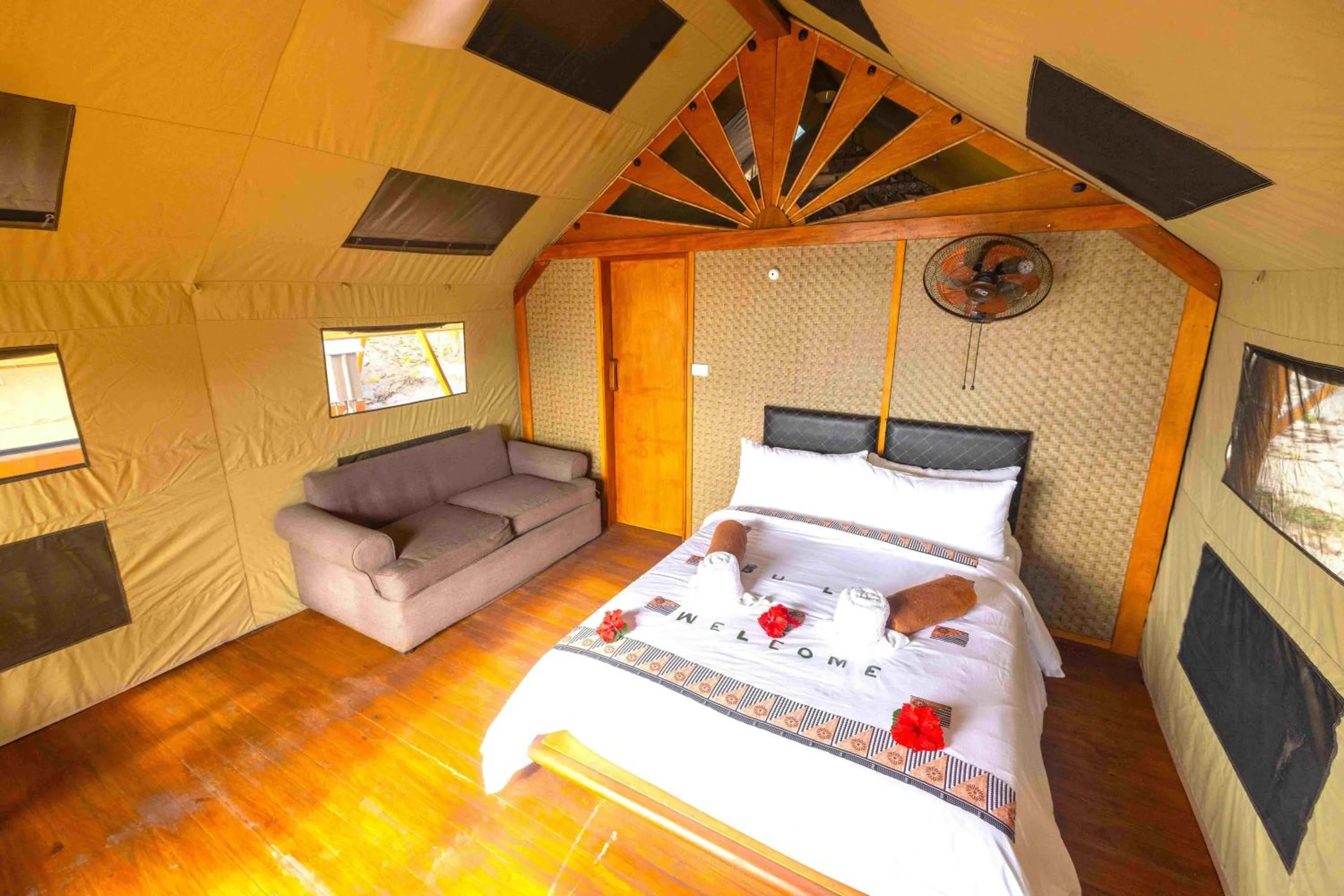 Bed in Barefoot Kuata Island Resort