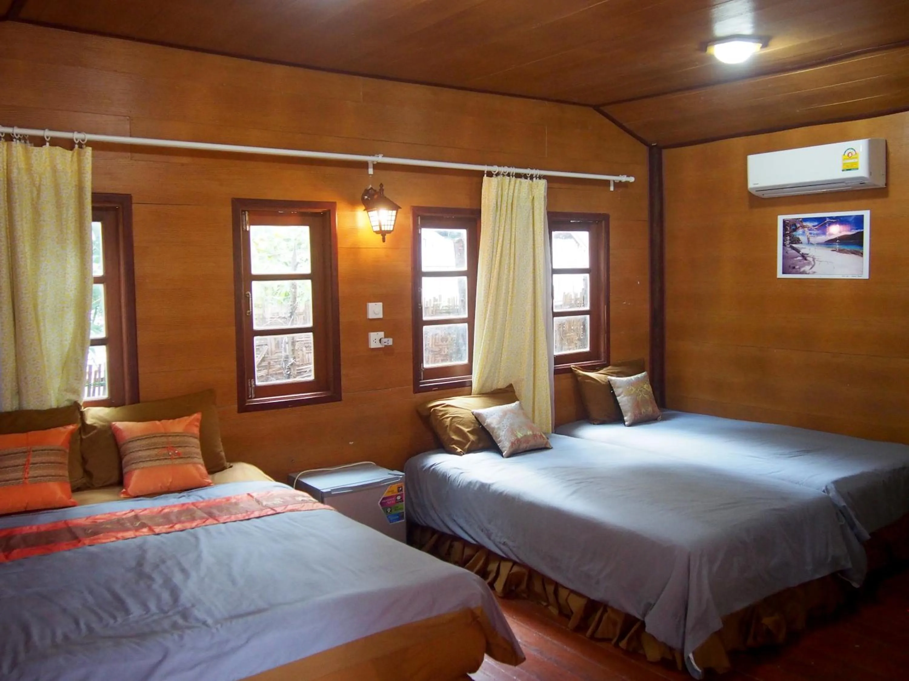 Bed in Coco Beach Bungalows