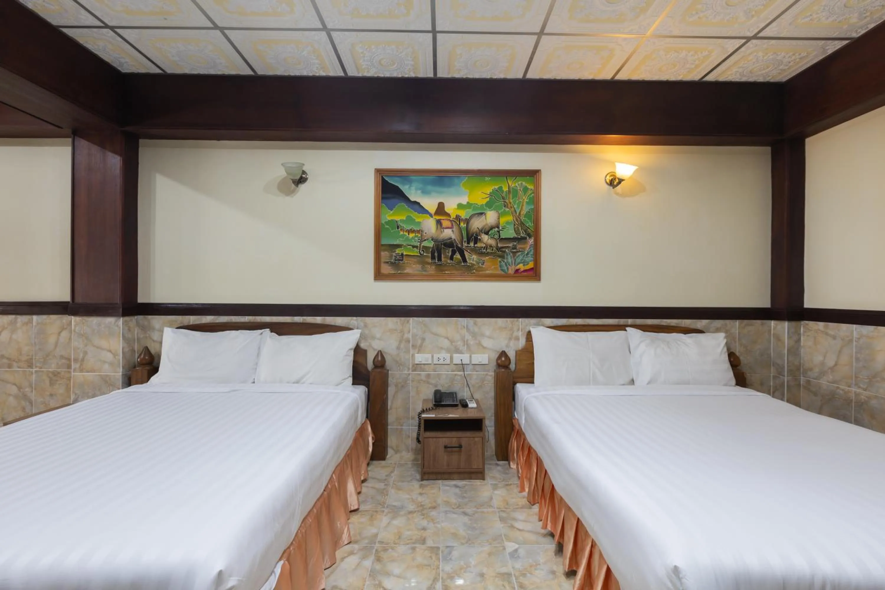 Bed in Kata Palace Phuket Hotel