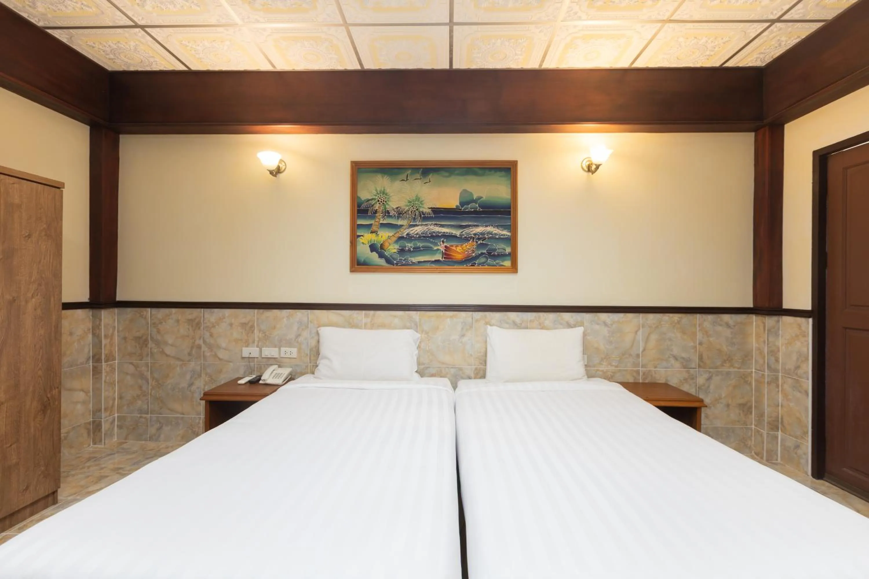 Bed in Kata Palace Phuket Hotel