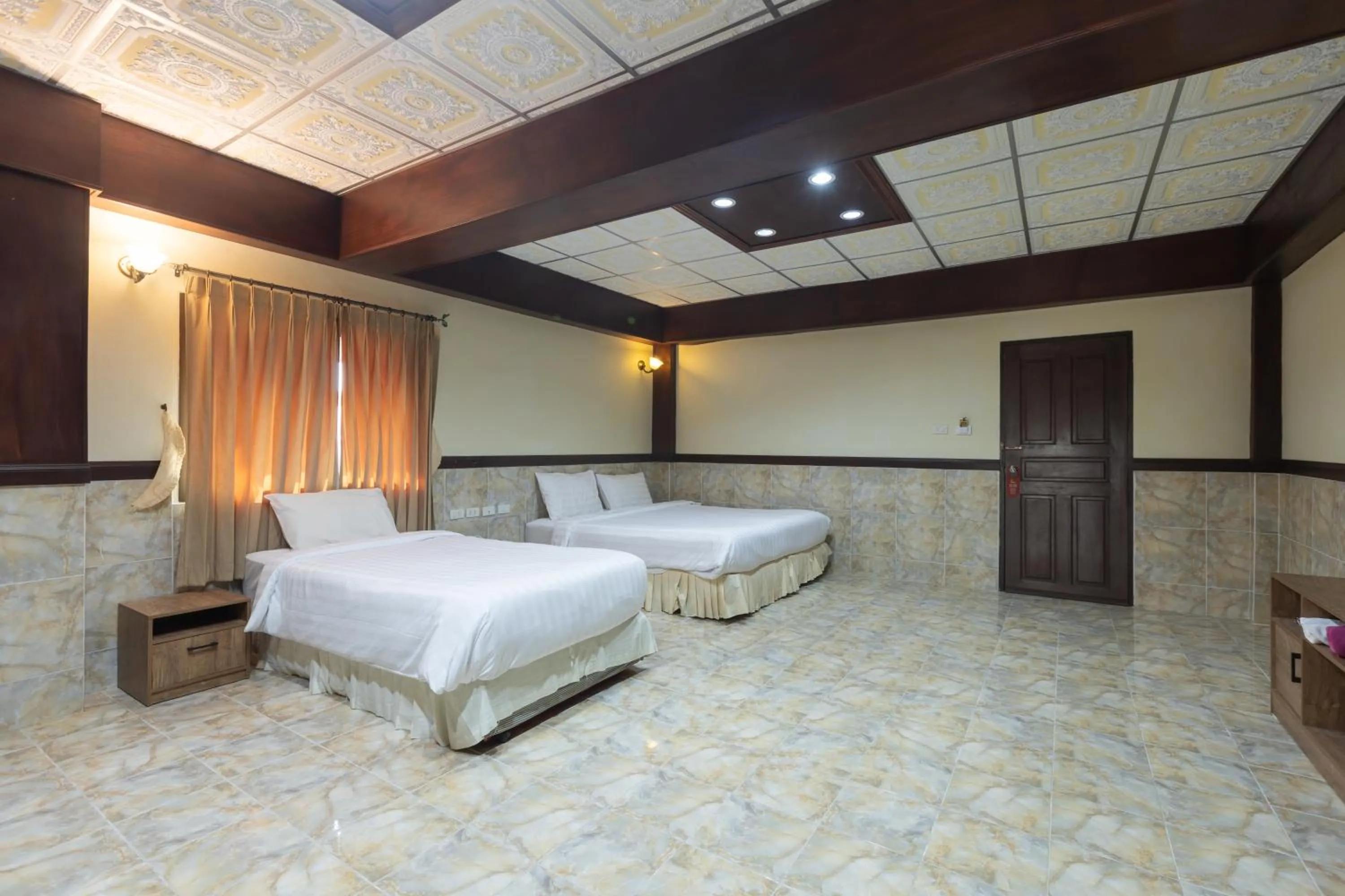 Bed in Kata Palace Phuket Hotel