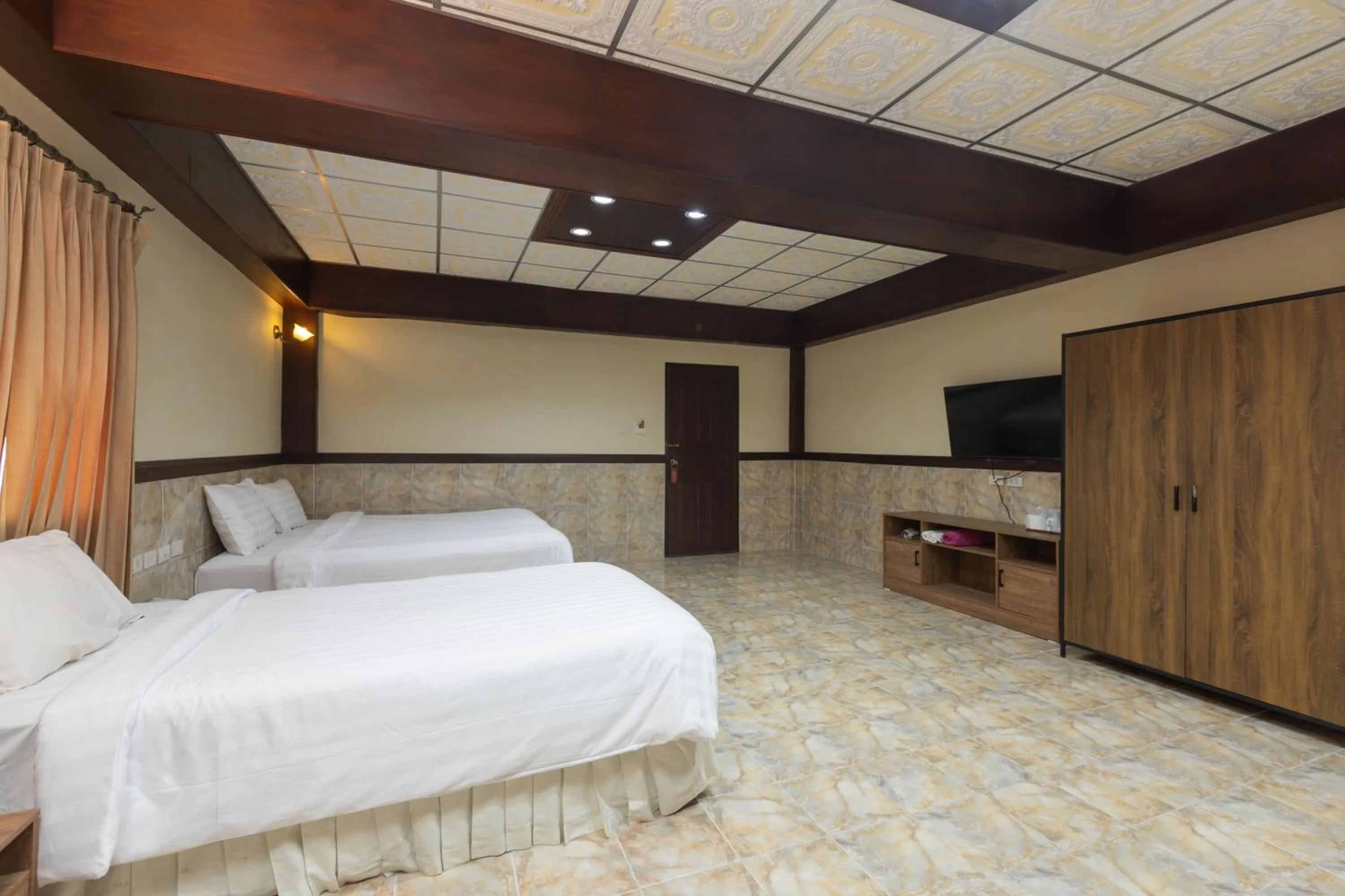 Bed in Kata Palace Phuket Hotel