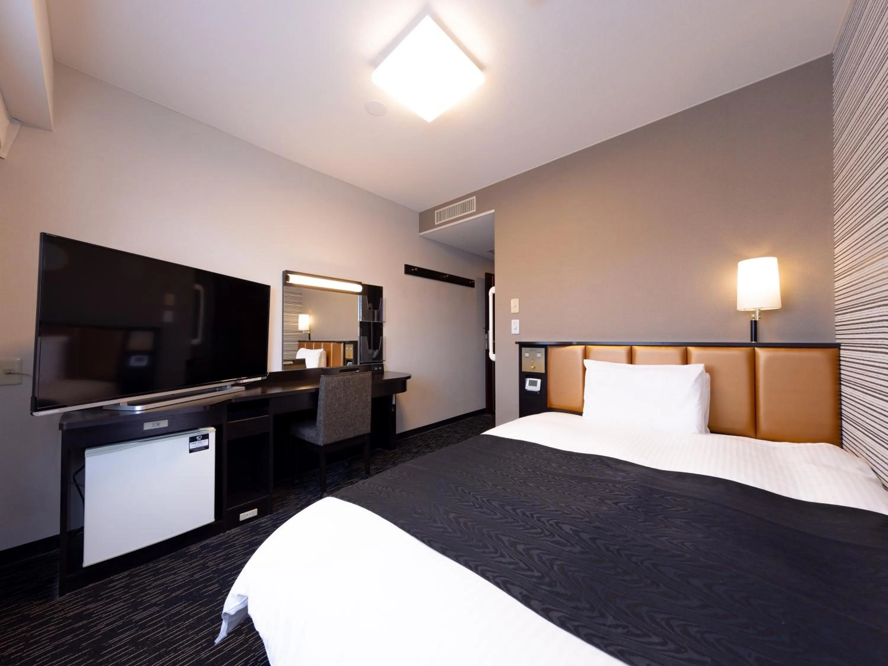 Photo of the whole room, Bed in APA Hotel Aomori Eki Kenchodori