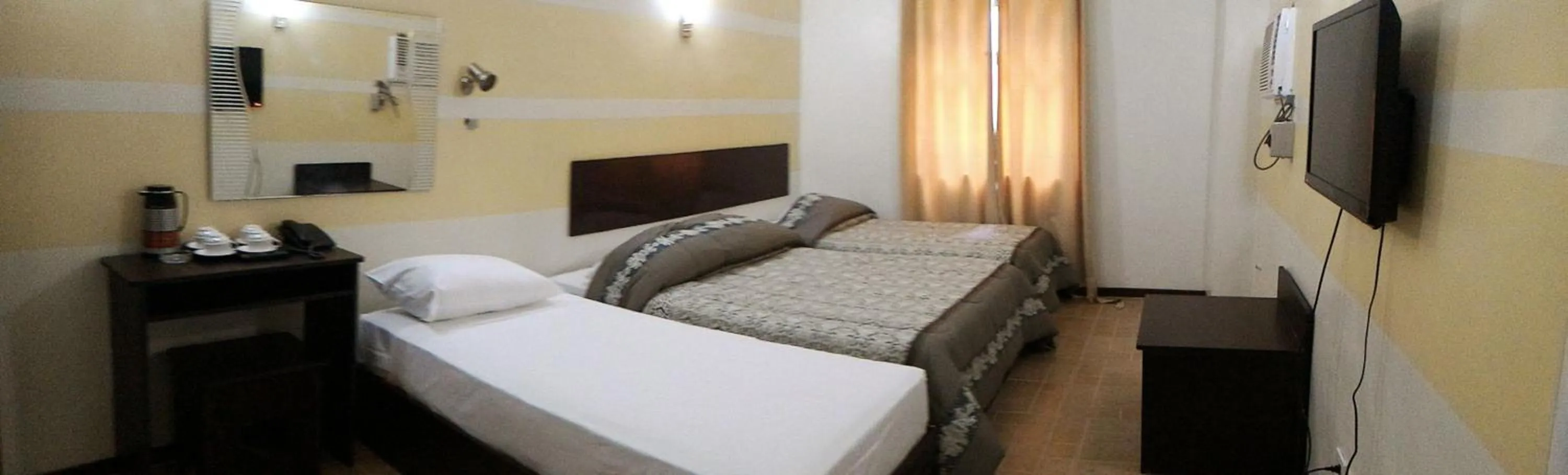 Photo of the whole room, Bed in Metro Park Hotel Mandaue