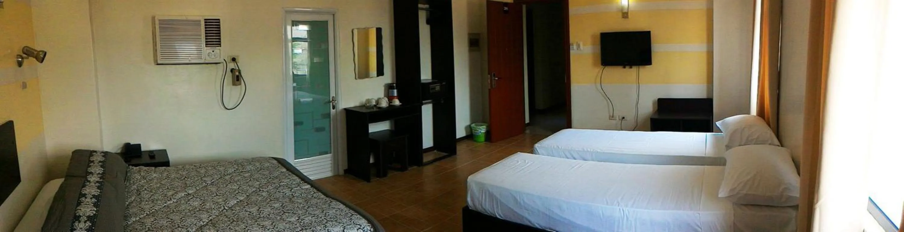 Photo of the whole room, Bed in Metro Park Hotel Mandaue