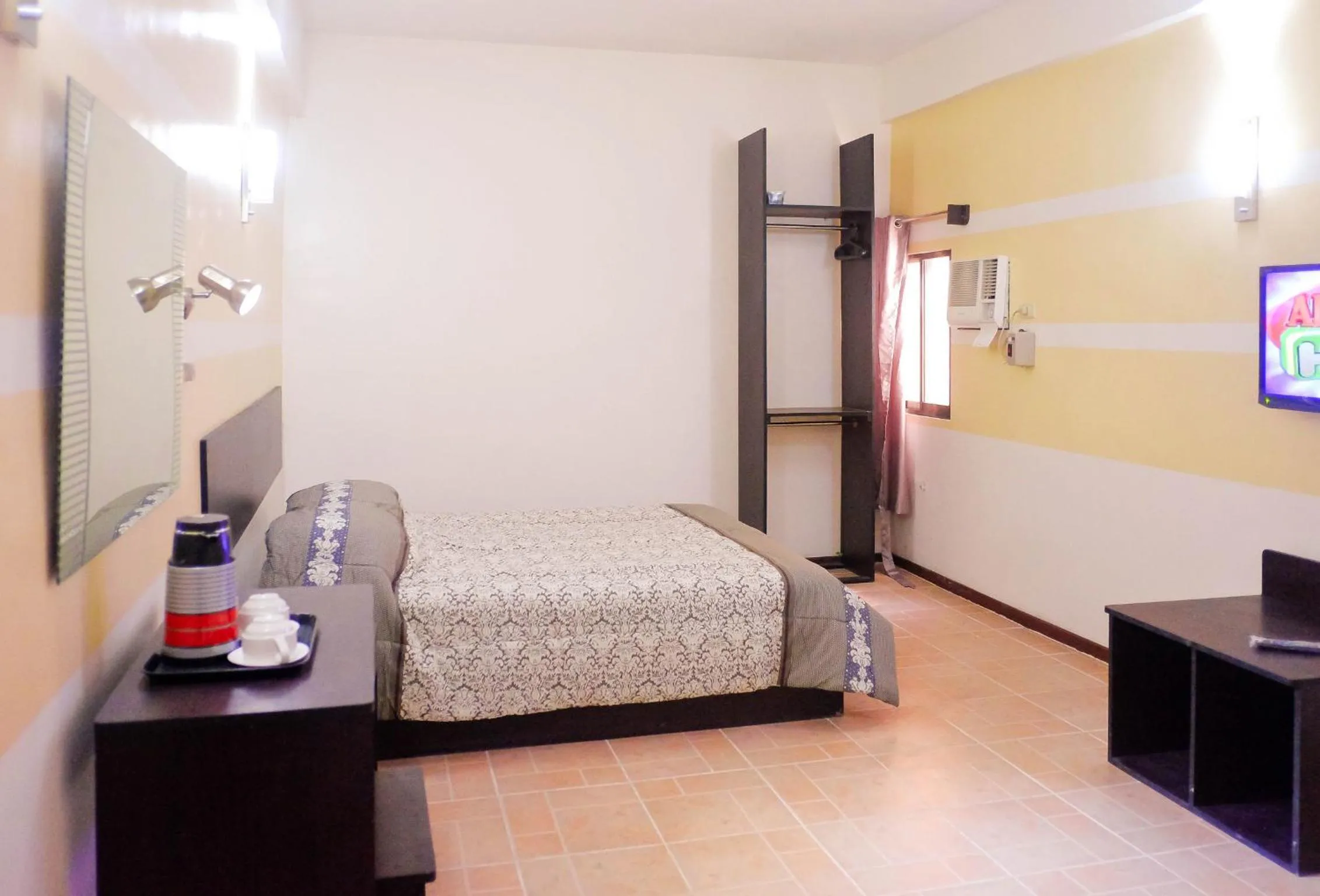 Photo of the whole room, Bed in Metro Park Hotel Mandaue