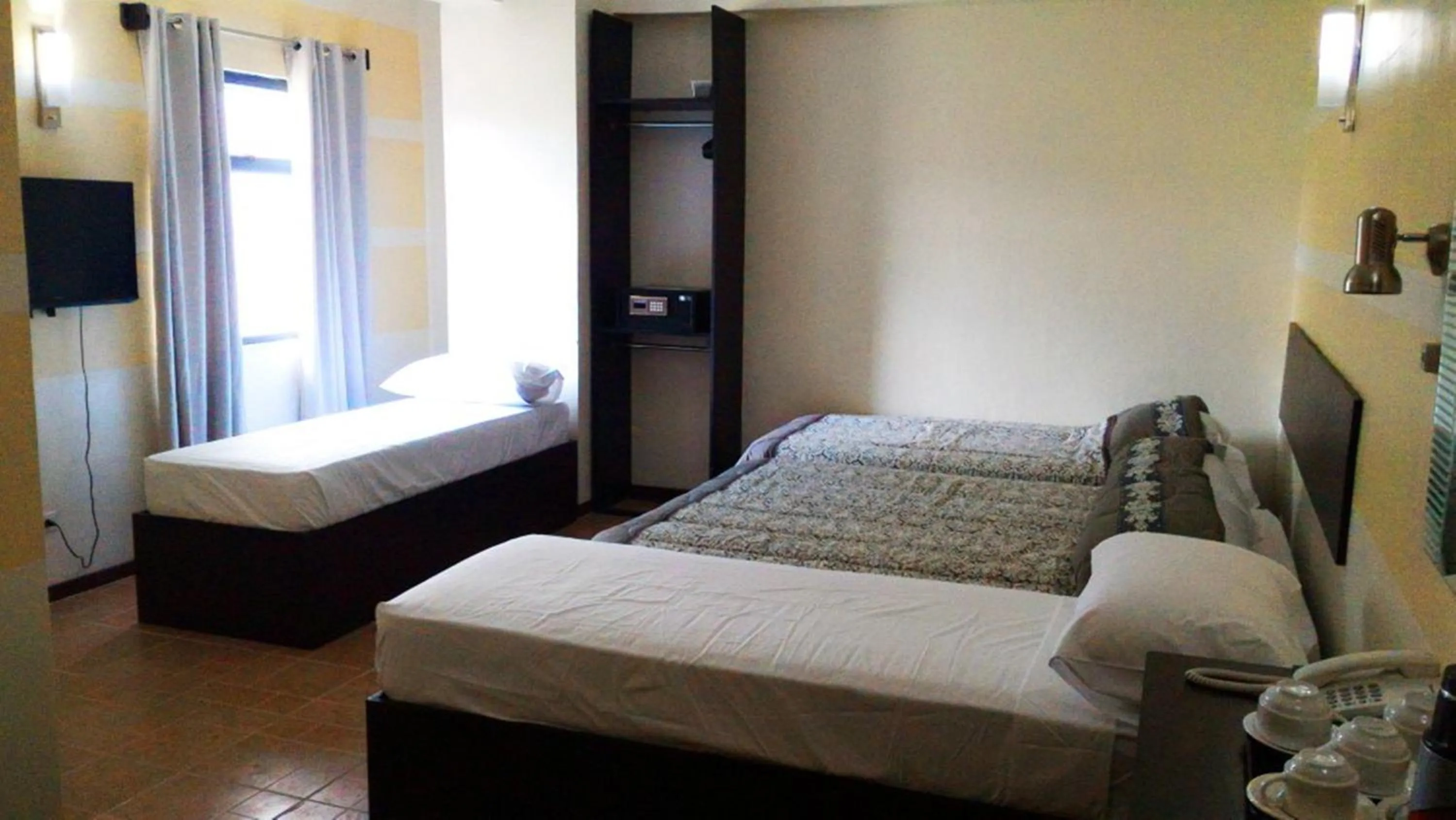 Photo of the whole room, Bed in Metro Park Hotel Mandaue