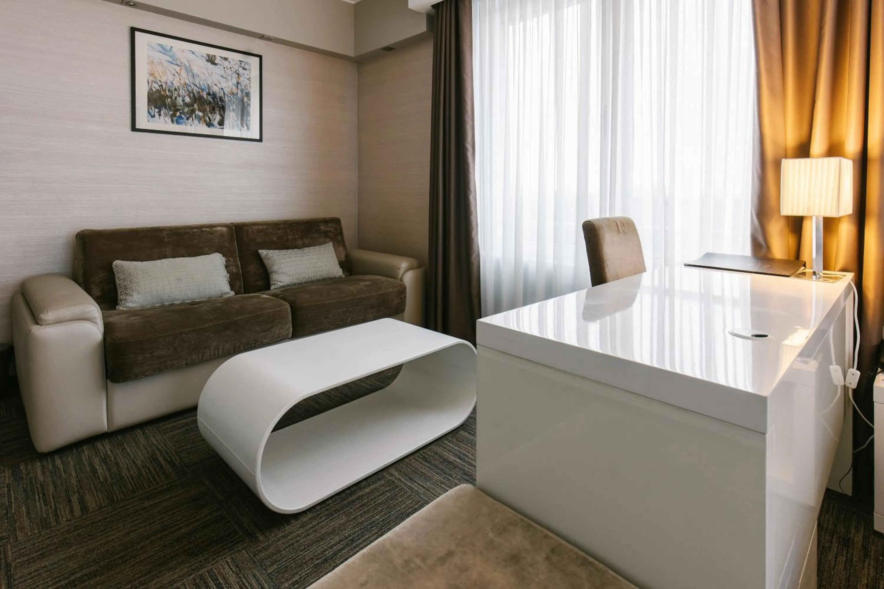 Seating area, Bed in Hotel Heritage