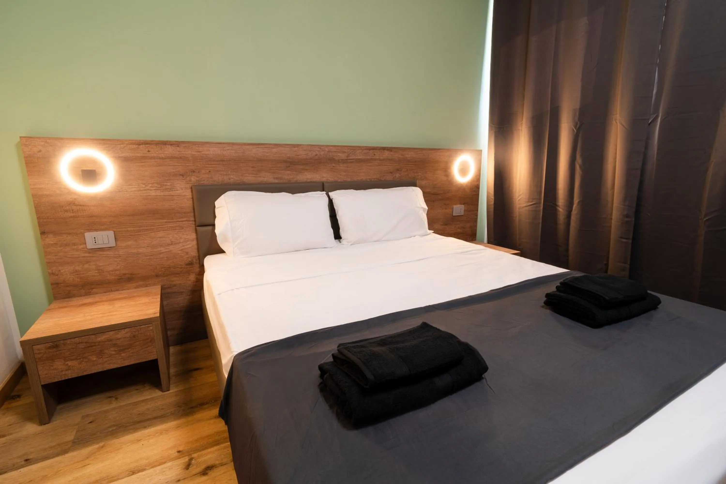 Bed in Elysium Self Check-In Rooms