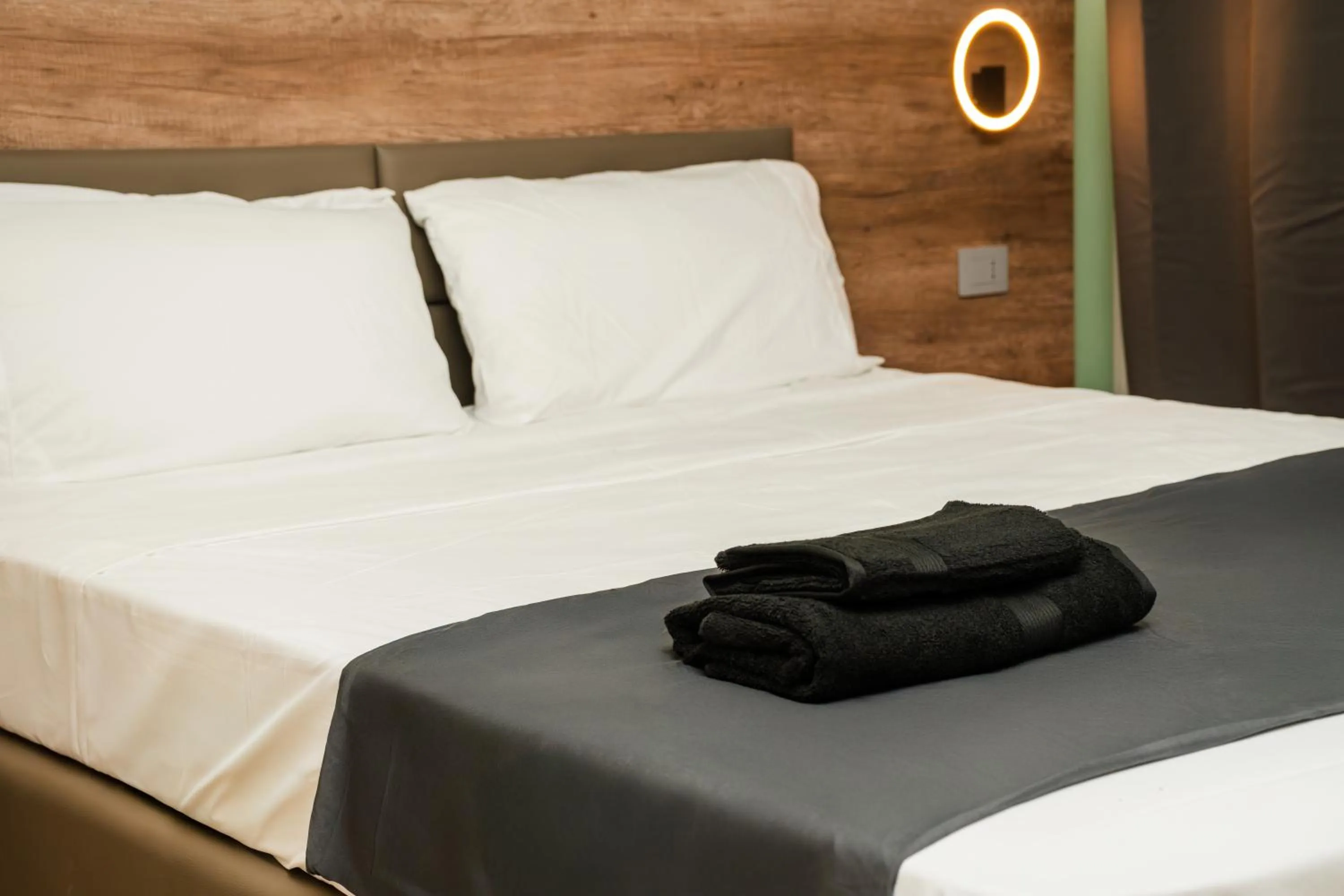 Bed in Elysium Self Check-In Rooms