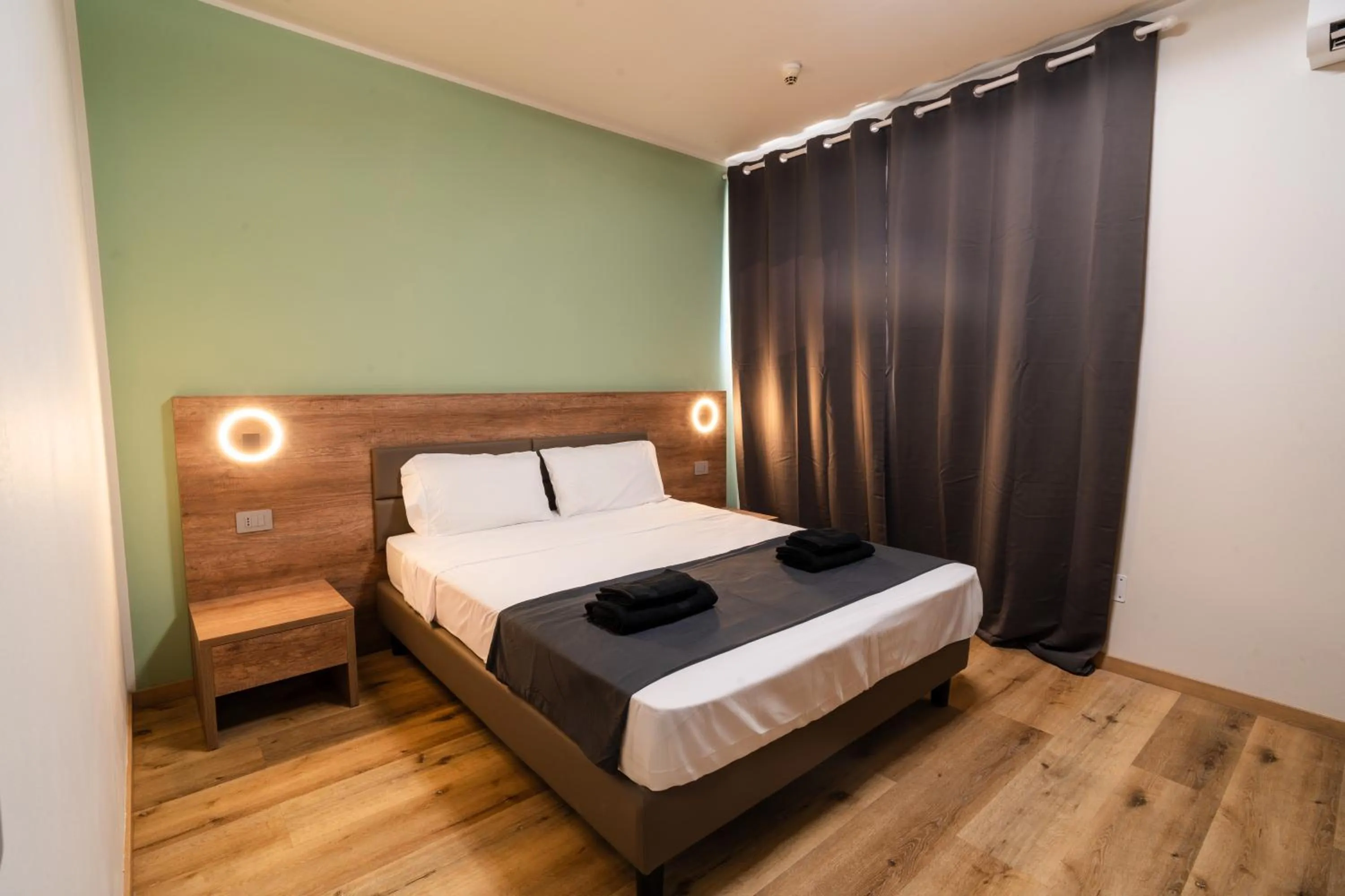 Bed in Elysium Self Check-In Rooms