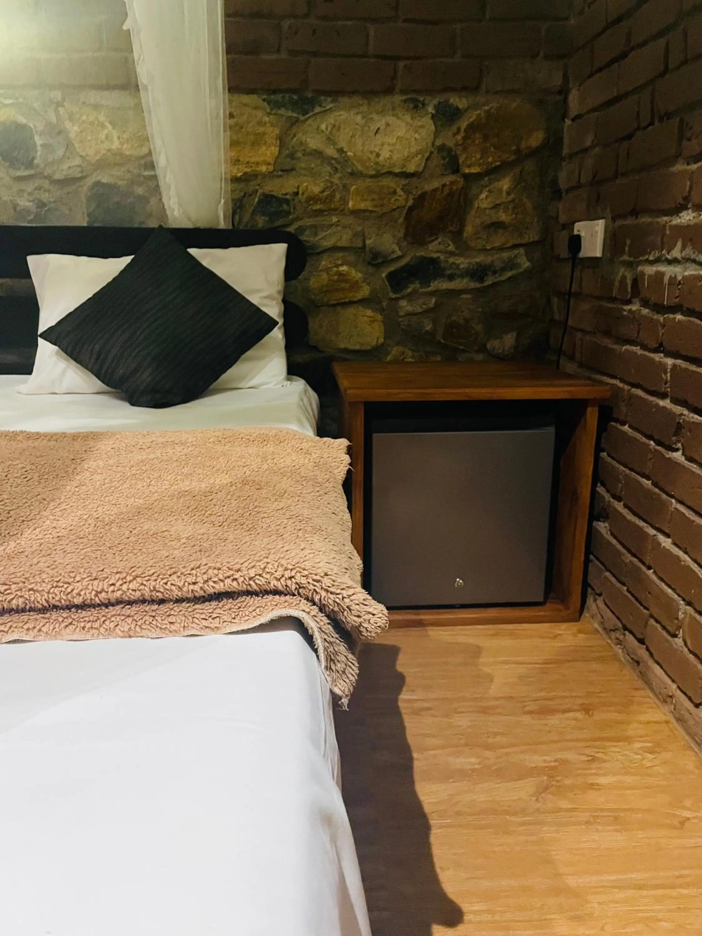 minibar, Bed in Wild Resort Ella