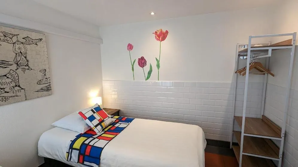 Bed in The Amsterdam Hotel Apartment in the Center