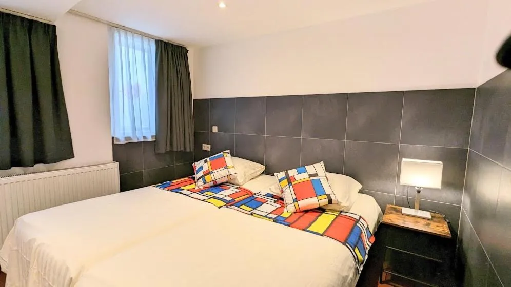 Bed in The Amsterdam Hotel Apartment in the Center