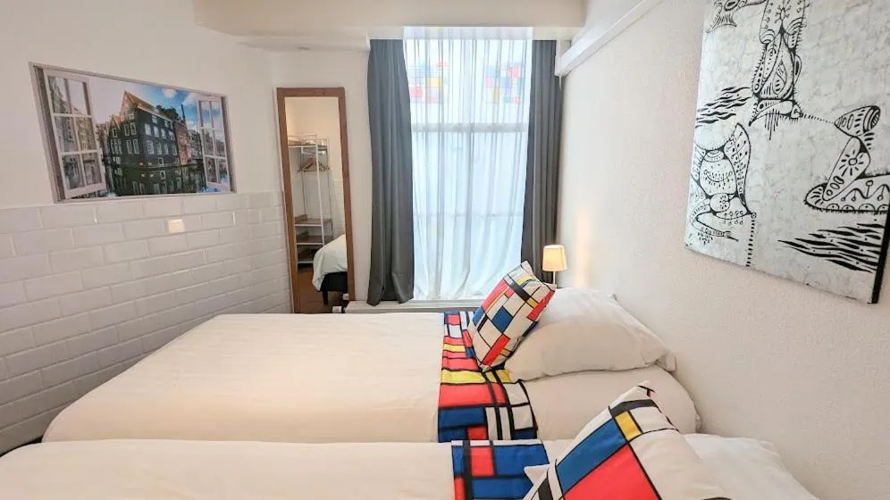 Bed in The Amsterdam Hotel Apartment in the Center