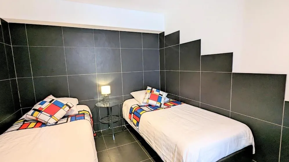 Bed in The Amsterdam Hotel Apartment in the Center