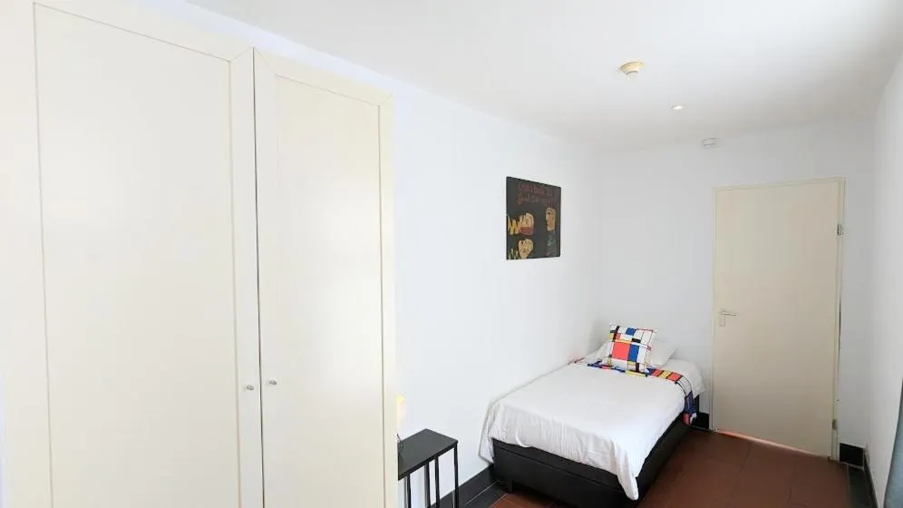 Bed in The Amsterdam Hotel Apartment in the Center