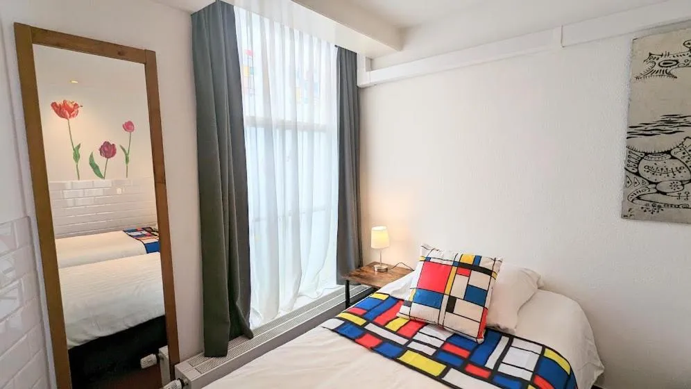 Bed in The Amsterdam Hotel Apartment in the Center