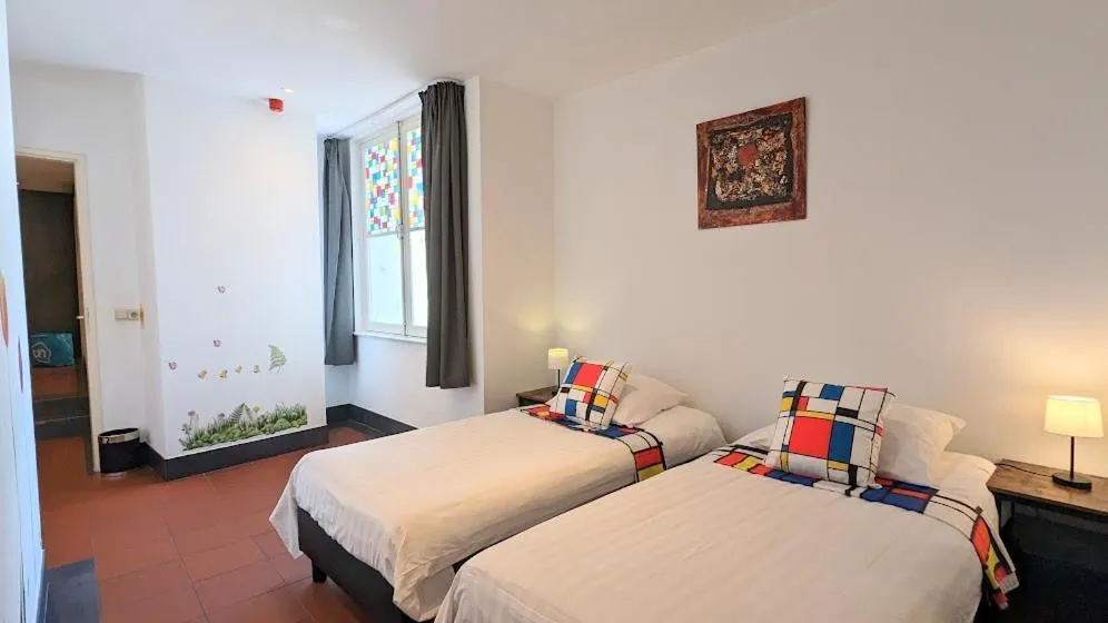 Bed in The Amsterdam Hotel Apartment in the Center