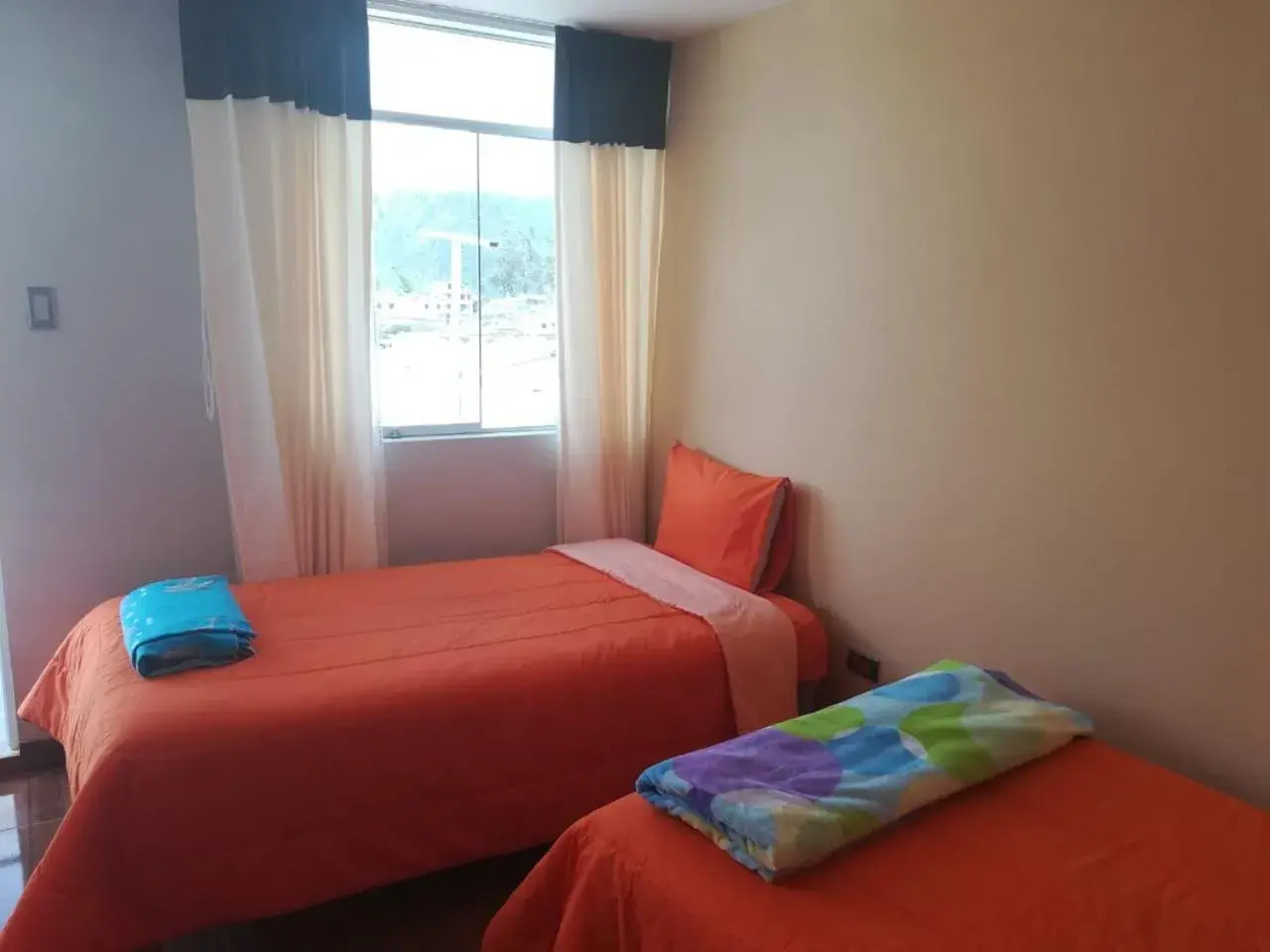 Basic Triple Room with Shared Bathroom in Arum Qurpawasi Hospedaje Basic Triple Room with Shared Bathroom in Arum Qurpawasi Hospedaje