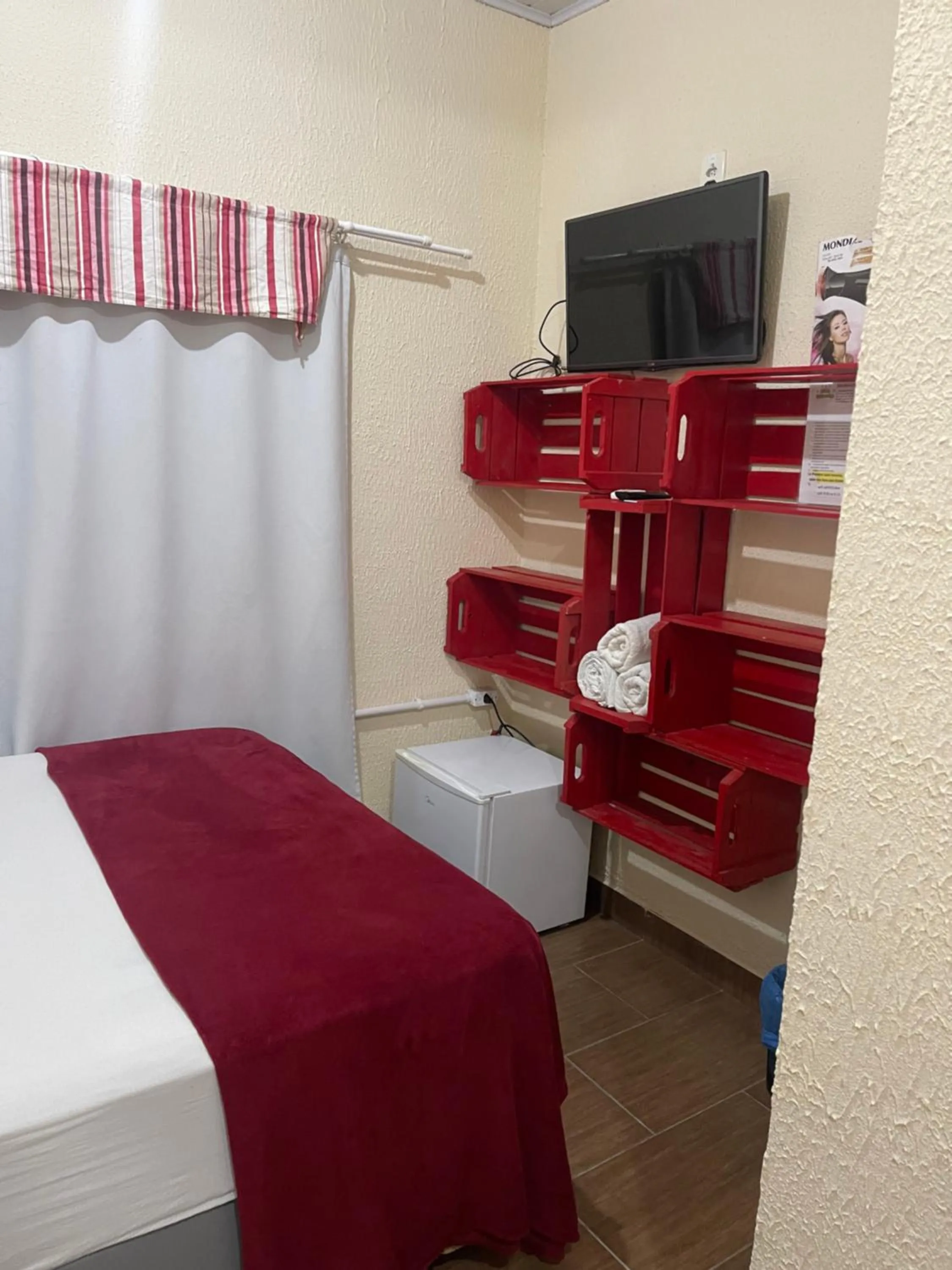 Bed in Pousada Quatro Estrelas