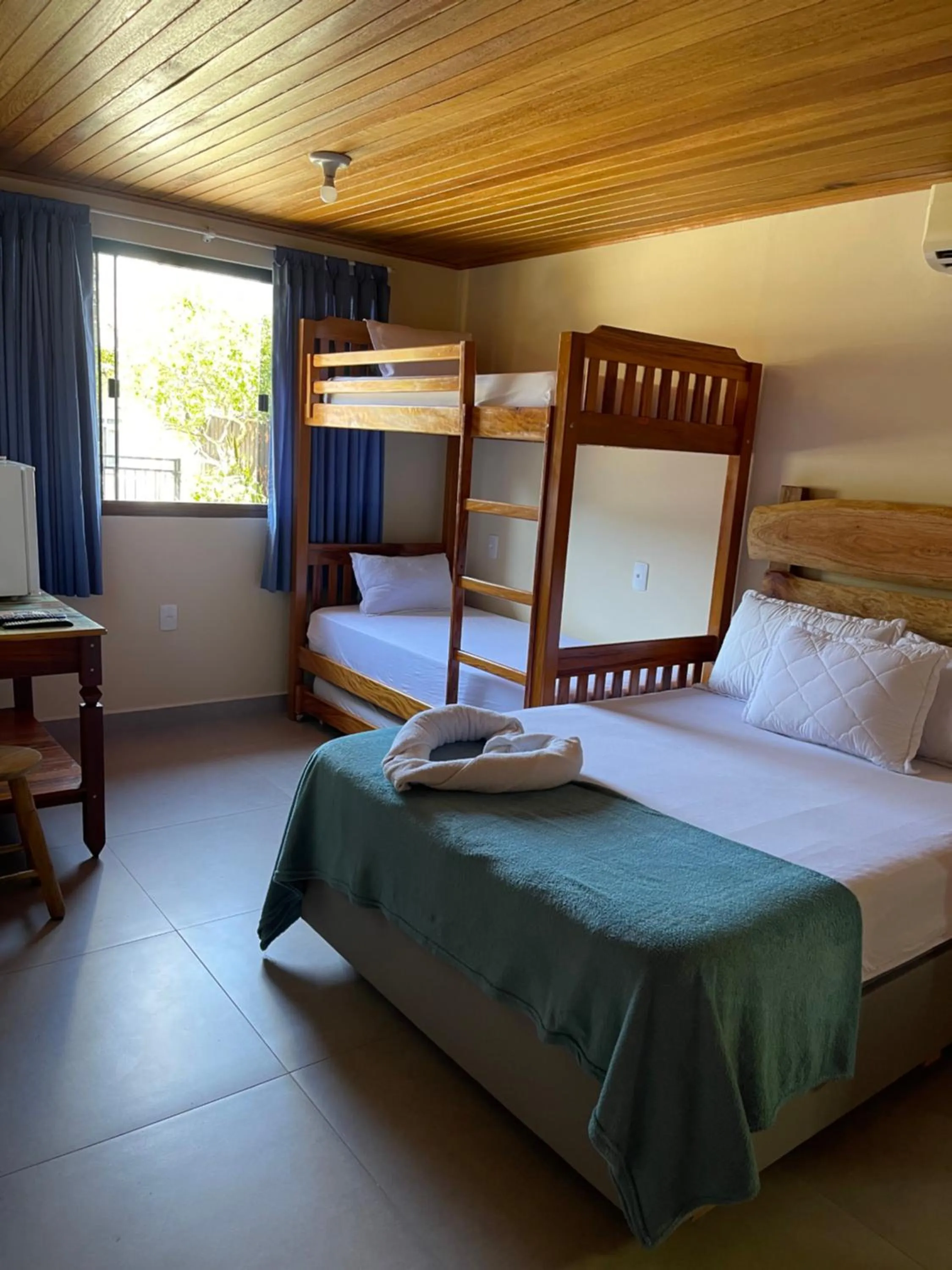 Bed in Pousada Quatro Estrelas