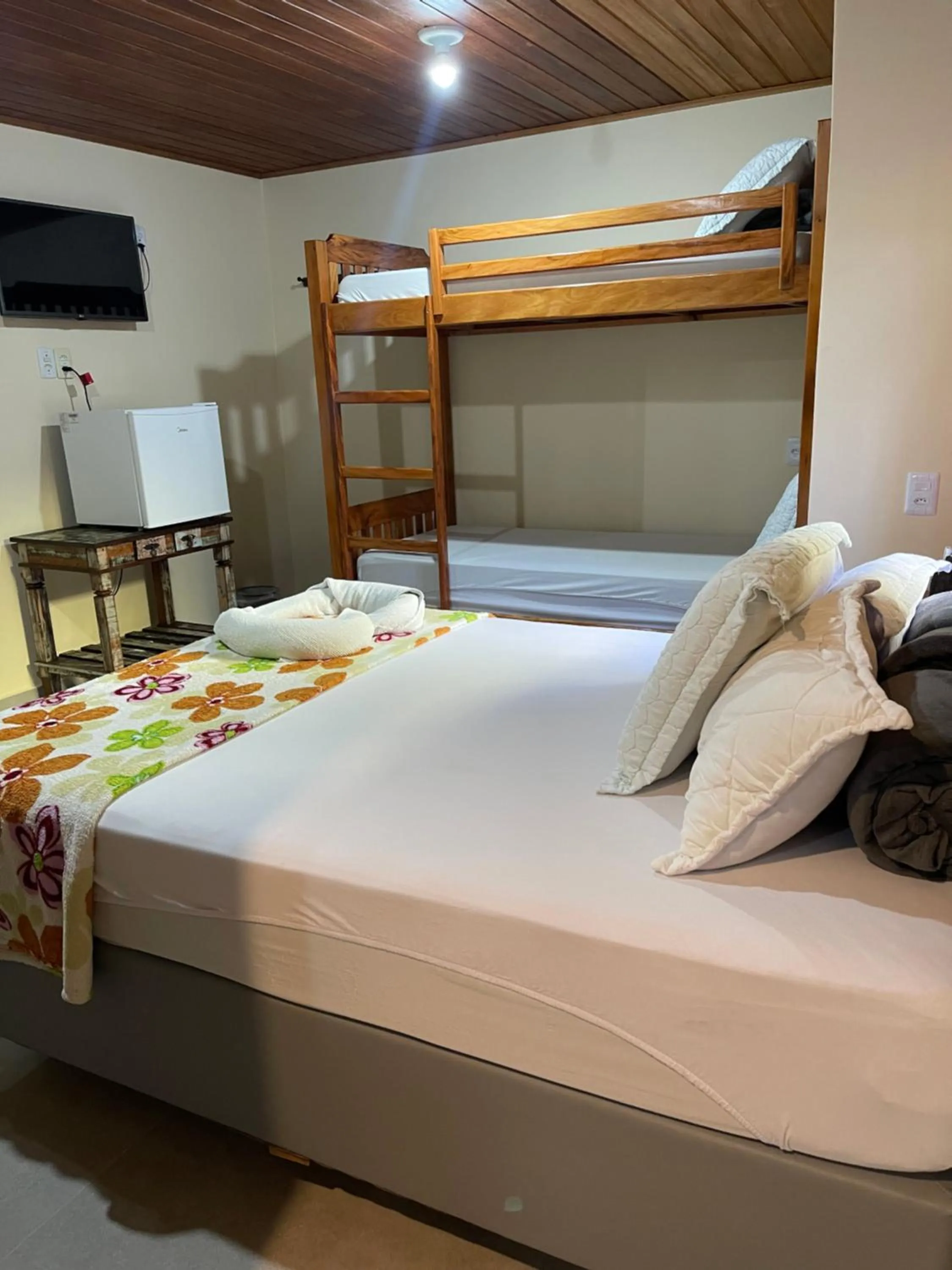 Bed in Pousada Quatro Estrelas