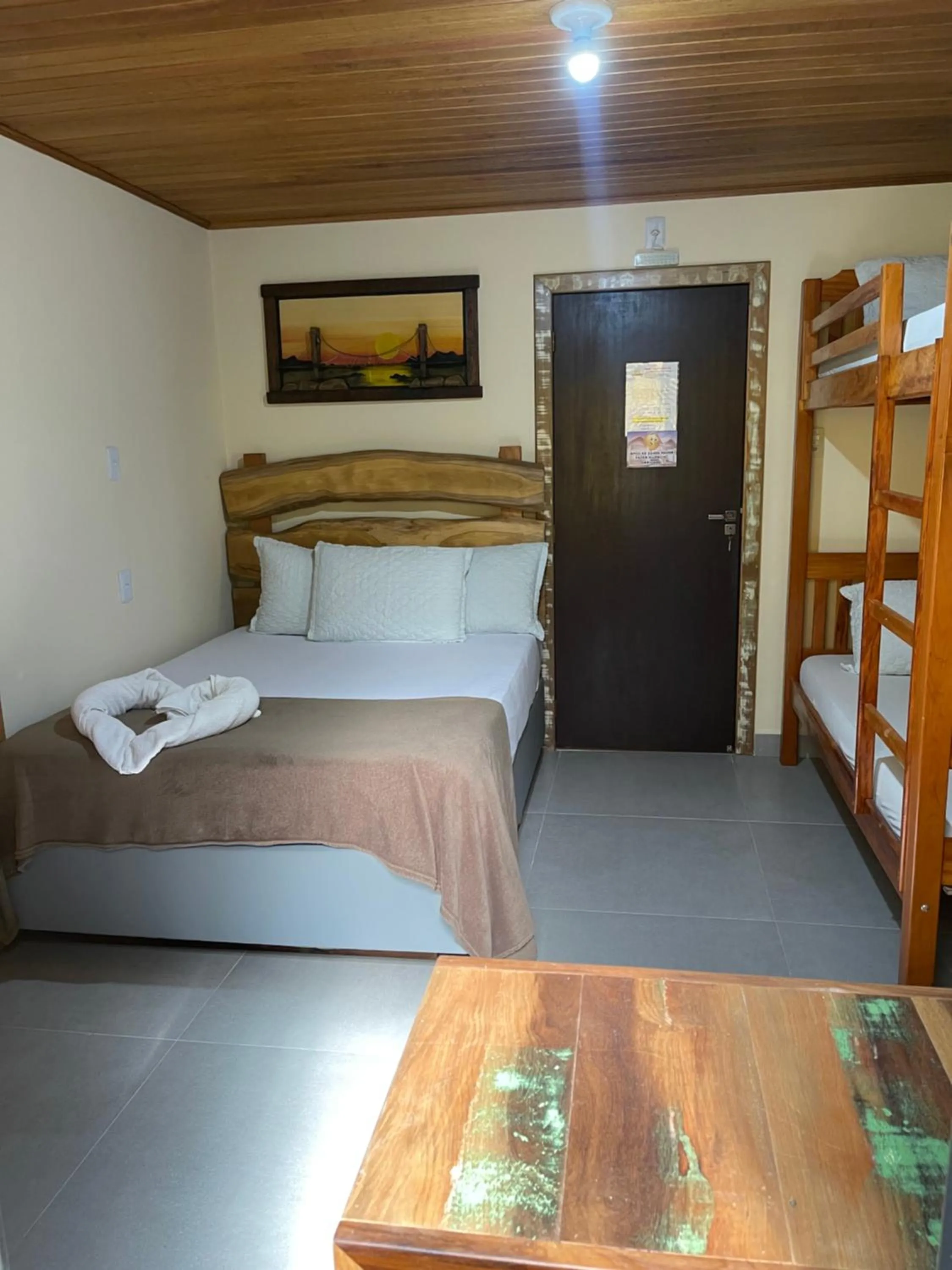 Bed in Pousada Quatro Estrelas