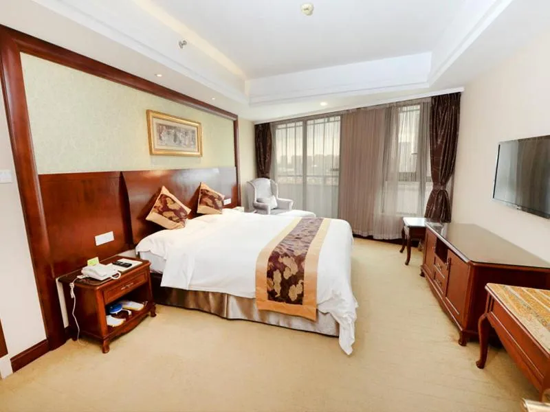 Bed in Vienna International Hotel Shanghai Hongqiao Hub International Exhibition Center