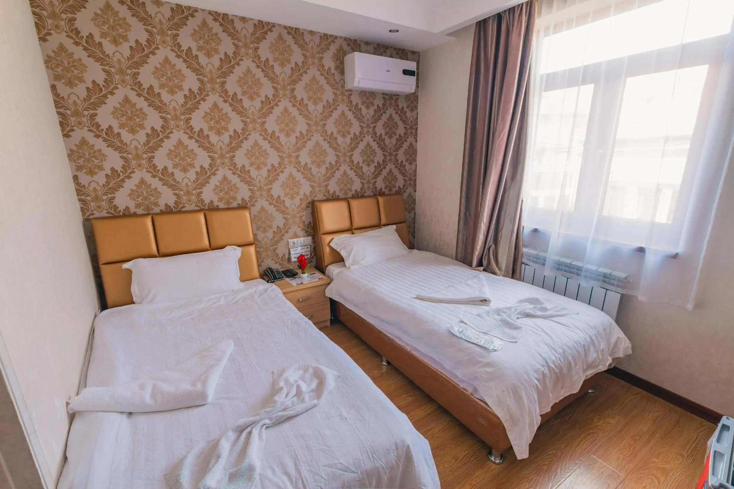 Bed in Hotel Garden House