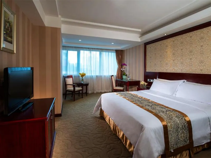 Bed in Vienna Hotel Shenzhen Fenghuang Road