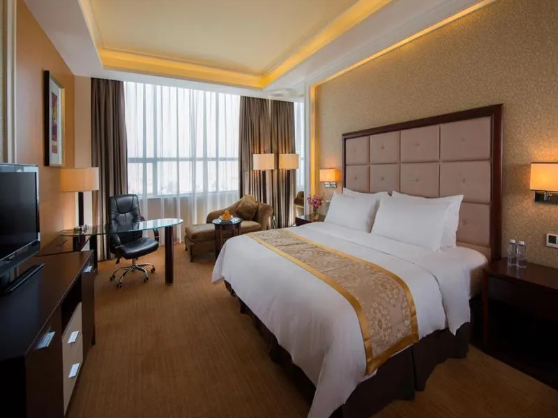 Bed in Vienna Hotel Shenzhen Exibition Center