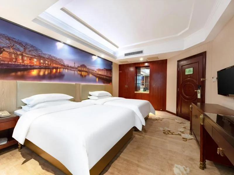 Bed in Vienna Hotel Shenzhen Songgang Shajiang Road